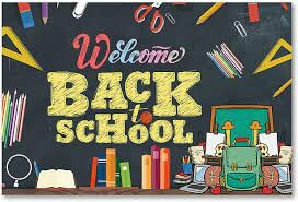 Colourful school supplies drawn on a chalk board with text reading Welcome Back to School